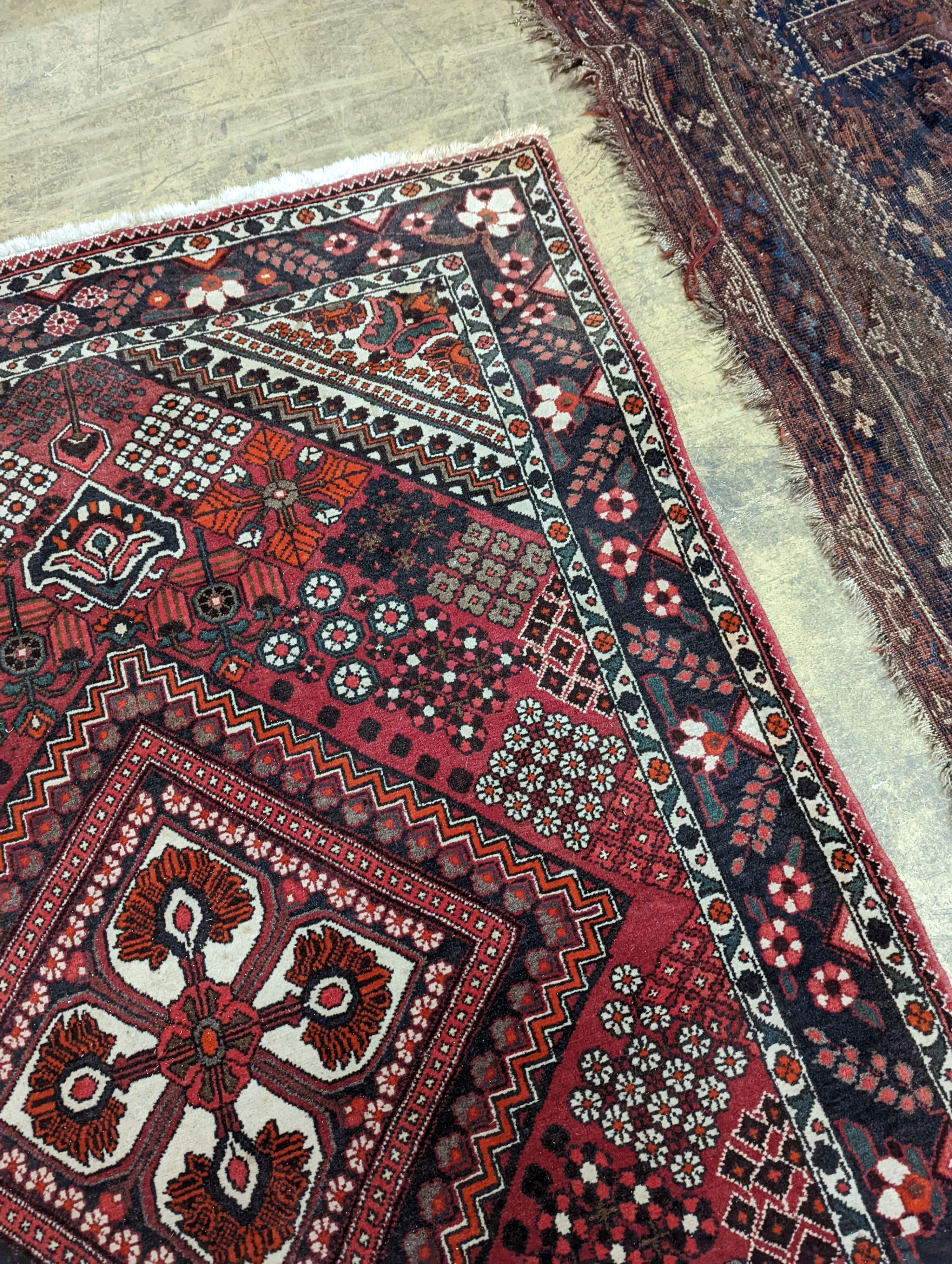 A North West Persian red ground rug, 200 x 130cm